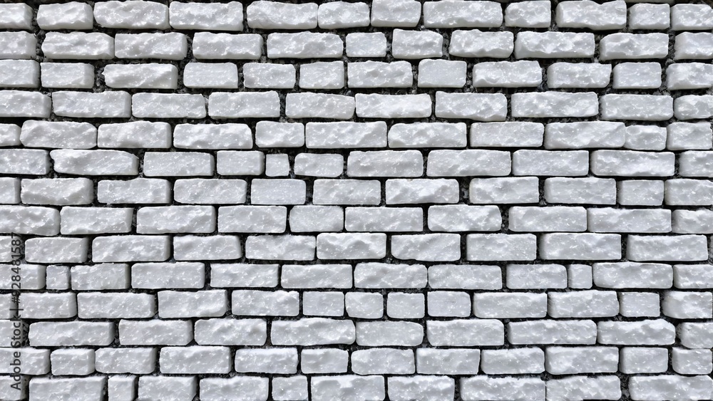 a white brick wall with a pattern of white bricks. a white brick wall with a pattern of white bricks.
