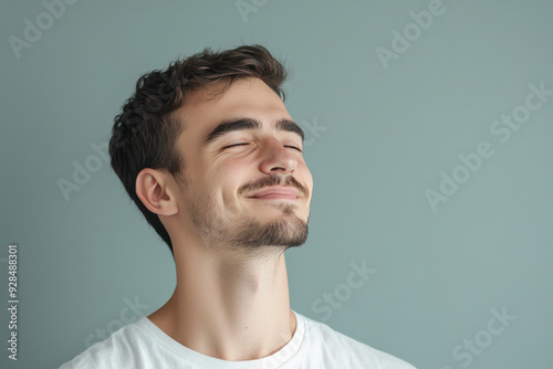 A close up of a man's face with his eyes closed