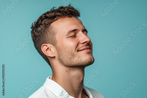 A close up of a man's face with his eyes closed