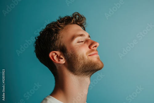 A close up of a man's face with his eyes closed