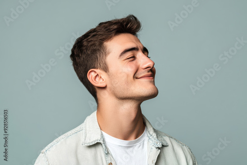 A close up of a man's face with his eyes closed