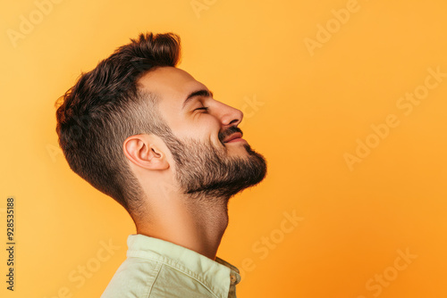 A close up of a man's face with his eyes closed