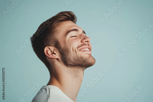 A close up of a man's face with his eyes closed