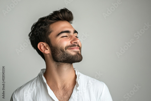 A close up of a man's face with his eyes closed