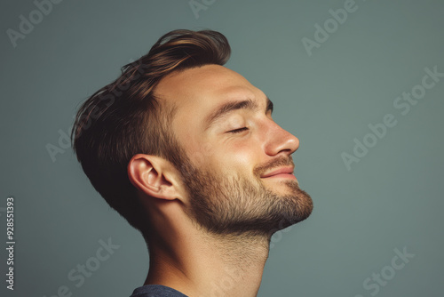 A close up of a man's face with his eyes closed