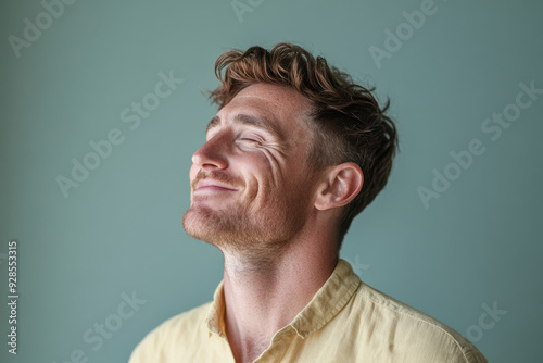 A close up of a man's face with his eyes closed