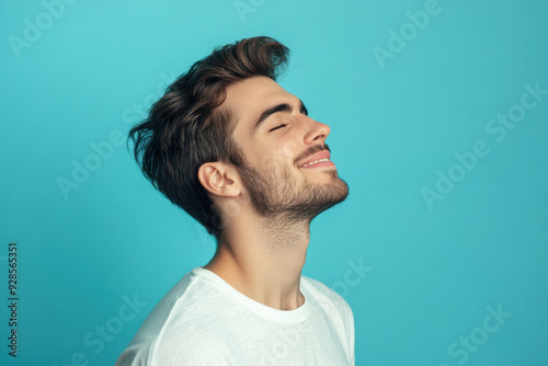 A close up of a man's face with his eyes closed