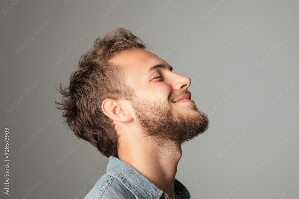 Obraz premium A close up of a man's face with his eyes closed