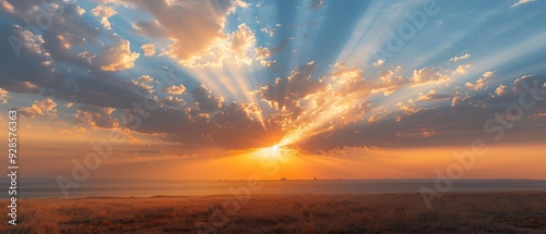 Majestic Sunrise: Golden Light Beams Through Dramatic Clouds