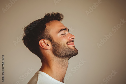 A close up of a man's face with his eyes closed