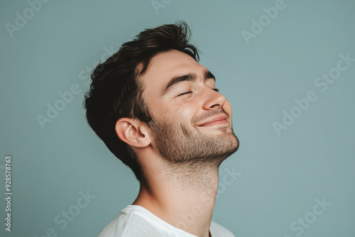 A close up of a man's face with his eyes closed