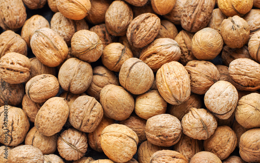 Top view of whole walnuts as background texture Top view of whole walnuts as background texture
