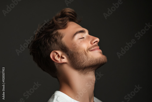 A close up of a man's face with his eyes closed