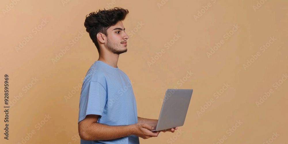 A person sitting with a laptop, ready to work or study