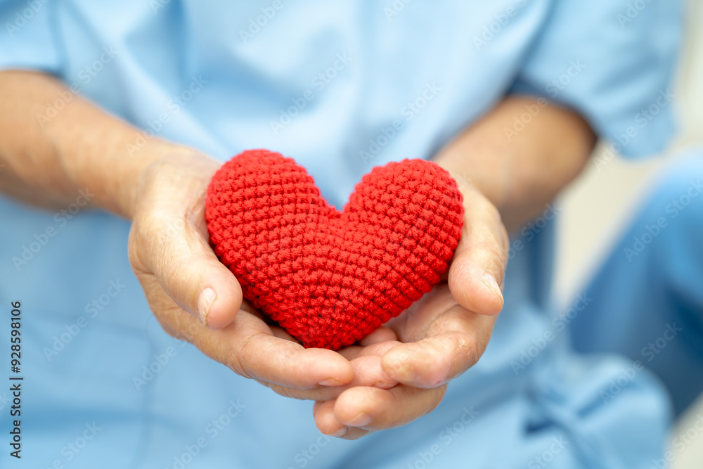 Asian doctor give red heart to elderly woman in her hand, heart Attack.5 Asian doctor give red heart to elderly woman in her hand, heart Attack.5
