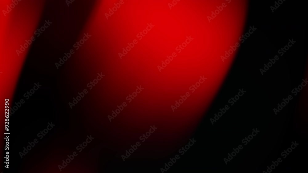 Abstract red and black gradient background with a smooth, flowing design.