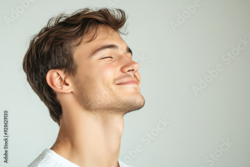 A close up of a man's face with his eyes closed