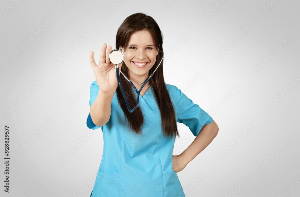 Happy young female doctor hold stethoscope Happy young female doctor hold stethoscope