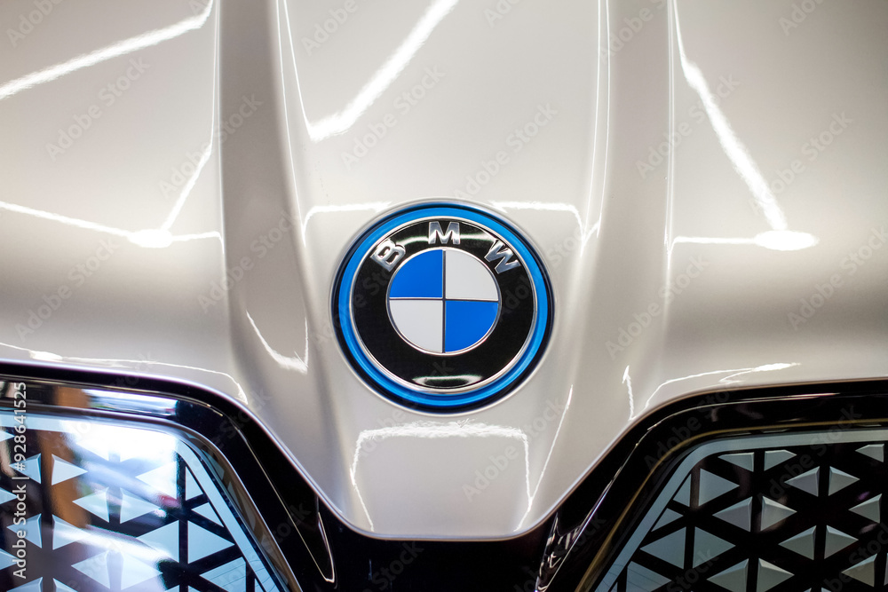 BMW iX logo on gray car Hood and black kidney grille closeup. Emblem of ...