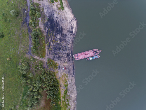 Aerial View of Docked Barges by Riverside photo