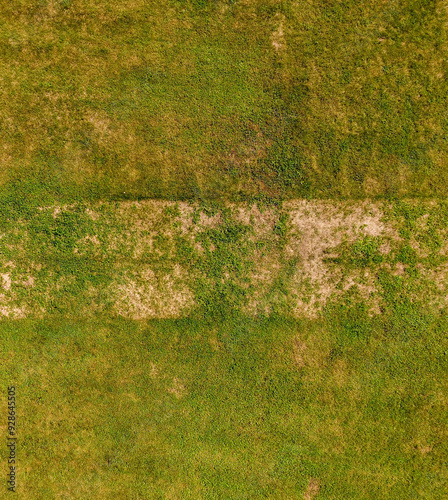 Aerial View of Grass Field with Patchy Areas