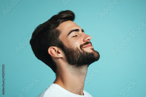 A close up of a man's face with his eyes closed