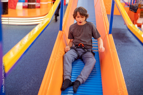 happy boy on a sports hill in a training hall. Active family recreation photo