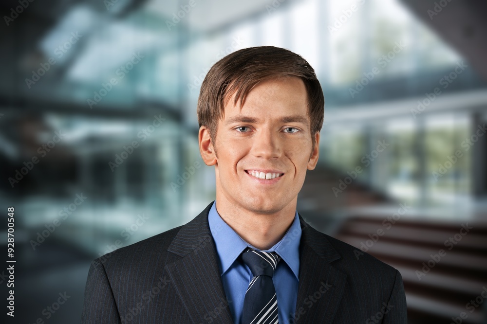 Happy professional business man posing in office. Happy professional business man posing in office.