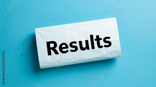 Close-up of a crumpled paper with the word results on a blue background