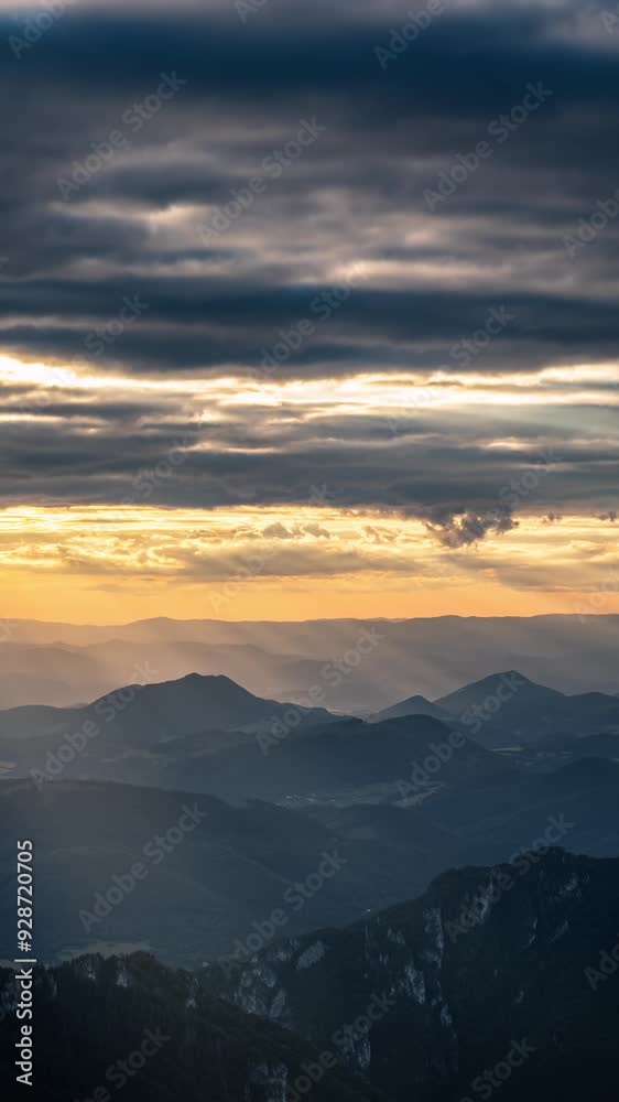 Vertical video of sunrise with golden light of sun over alpine mountains landscape, tourism adventure Vertical video of sunrise with golden light of sun over alpine mountains landscape, tourism adventure