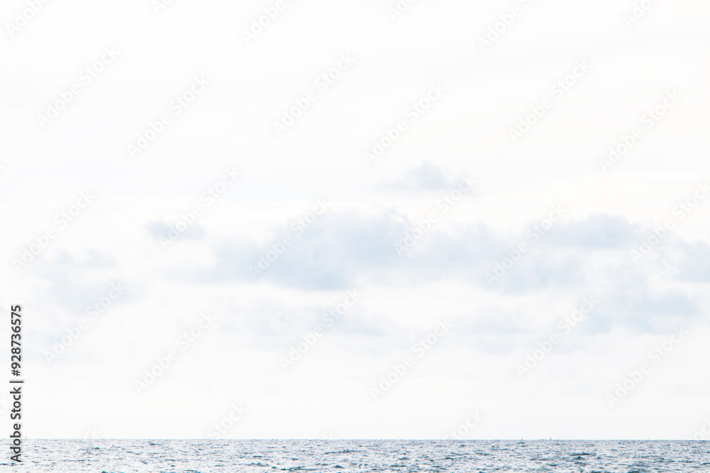 Obraz premium Morning of blue with cloud sea on horizon. Beautiful wave ocean wave on clean sandy beach. Sand surfing at Thailand. Waves sea crashing shore Abstract texture. Summer day and sandy background concept.