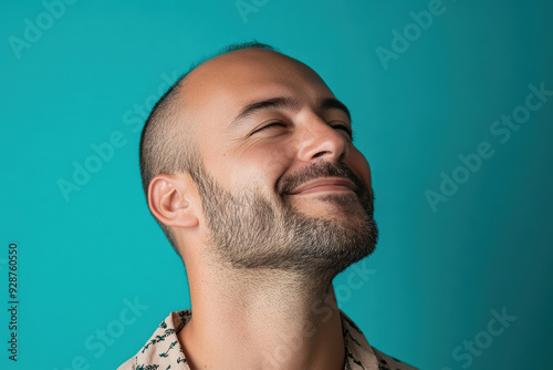 A close up of a man's face with his eyes closed