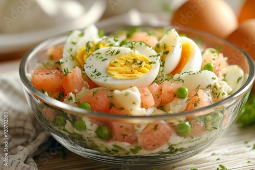 'A close-up of Olivier salad in a glass bowl, topped with intricately sliced eggs, set on a rustic wooden background with a festive napkin, perfect for a Christmas holiday celebration.'