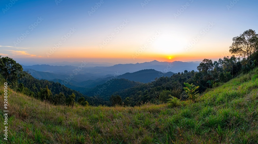 A beautiful mountain range with a sunset in the background A beautiful mountain range with a sunset in the background