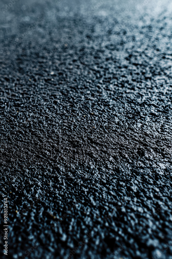 Close-up of a textured asphalt road surface, showcasing the rough and rugged texture in detail, perfect for backgrounds or industrial concepts. Close-up of a textured asphalt road surface, showcasing the rough and rugged texture in detail, perfect for backgrounds or industrial concepts.