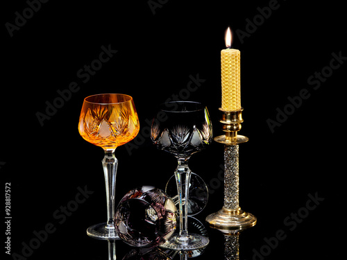 Still life with goblets and candlestick on black