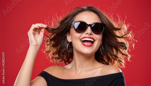 Woman happy on red background in sunglasses black. banner for advertising