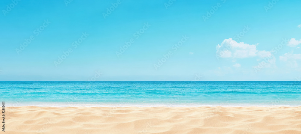 Obraz premium Tropical beach with golden sand, turquoise water, and a bright blue sky. The scene is peaceful and captures the essence of a perfect seaside day.