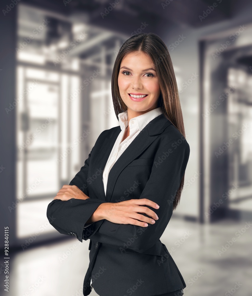 Smiling business woman entrepreneur standing in office Smiling business woman entrepreneur standing in office