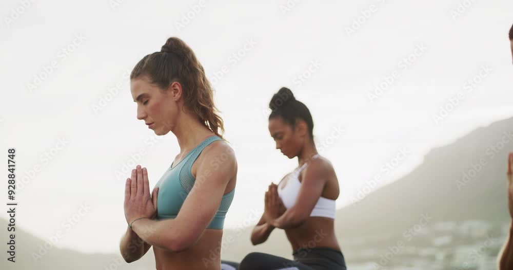 Fitness, meditation and people at beach with praying hands yoga pose for wellness on sky background. Zen, freedom or group in nature for energy, training or holistic breathing workout in sports club Fitness, meditation and people at beach with praying hands yoga pose for wellness on sky background. Zen, freedom or group in nature for energy, training or holistic breathing workout in sports club