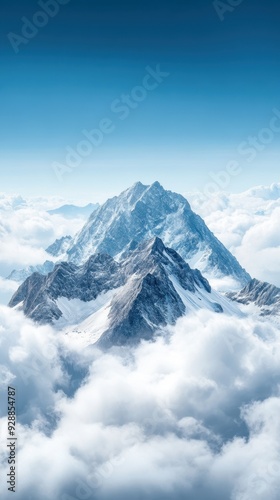 A breathtaking view of a majestic mountain peak rising above soft clouds, capturing the serene beauty of nature.