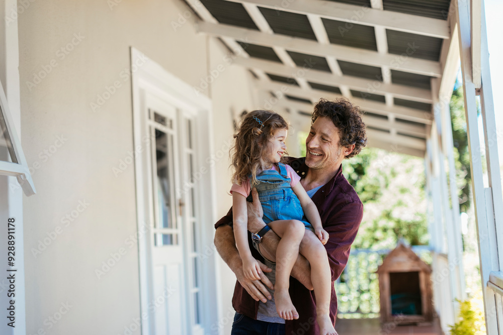 Father playing with daughter on porch Father playing with daughter on porch