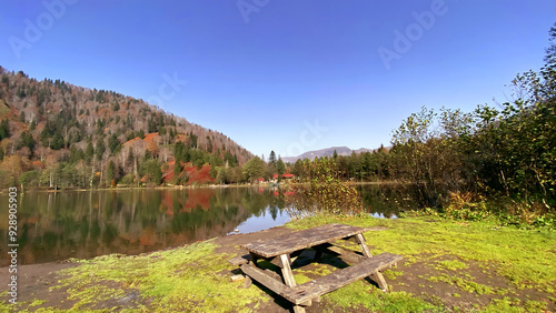 Karagöl, Borçka, Artvin, Turkey - 14 October 2021. Autumn view from Karagöl in Borçka district of Artvin province. Borcka Karagol Nature Park. The forest scene reflected in the still lake. photo