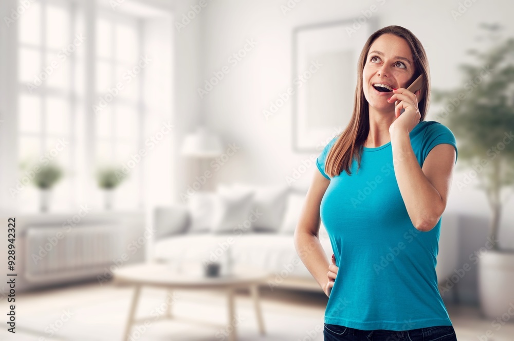 Shot of smiling happy young woman using mobile phone Shot of smiling happy young woman using mobile phone