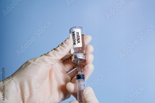 Close-up of mRNA(messenger RNA) vaccine and syringe photo