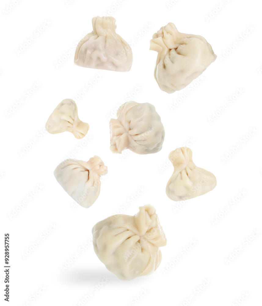 Fototapeta premium Delicious khinkali (Georgian dumplings) falling on white background