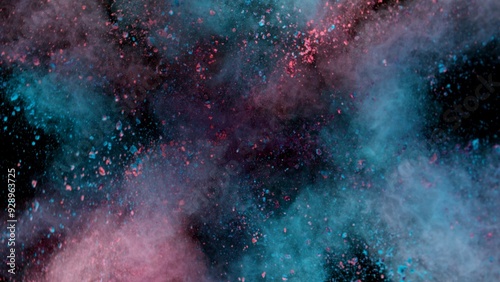 Colored powder explosion on black background . Freeze motion.