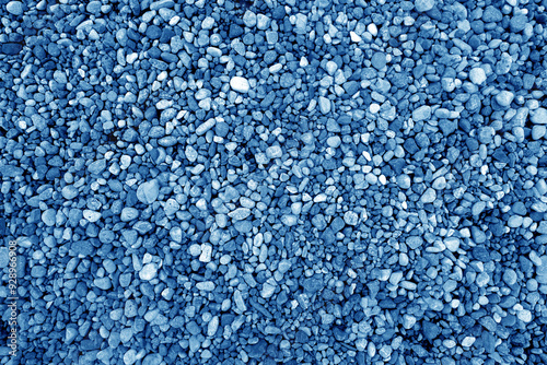 Φωτογραφία Pile of blue color decorative pebblestones as background.