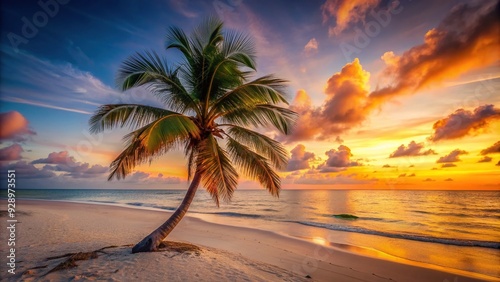 Isolated palm tree stands tall on a serene white sand beach at sunset, with gentle waves and a warm orange sky in the background.