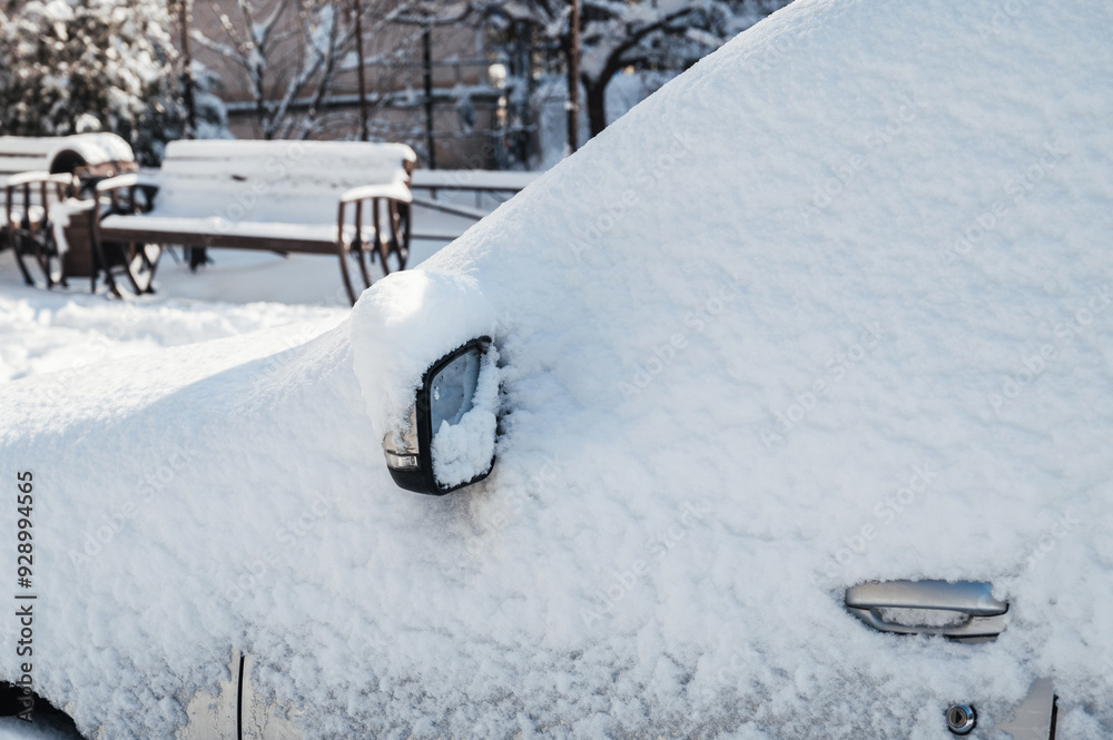 close-up Car on a street covered with big snow layer close-up Car on a street covered with big snow layer